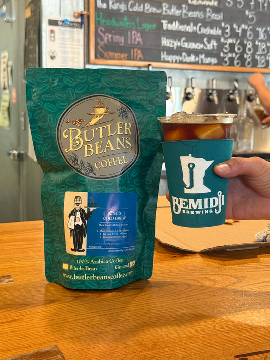 Bag of King’s Cold Brew Coffee next to glass of iced cold brew. Served on tap at Bemidji Brewing